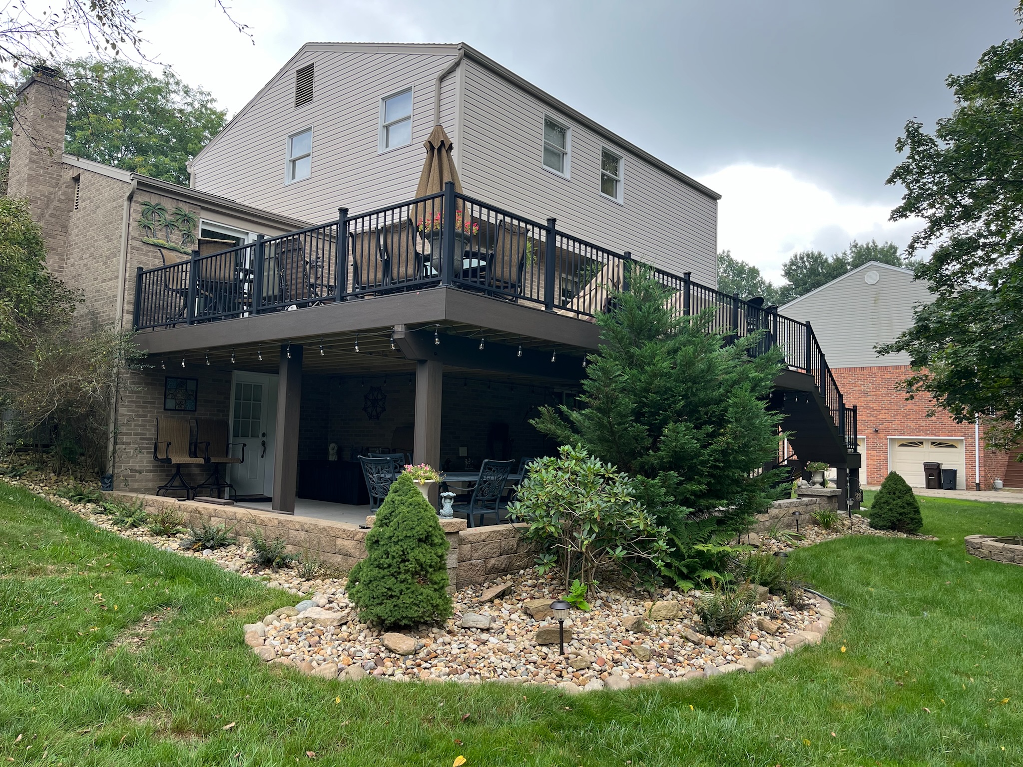custom home deck build with black railing