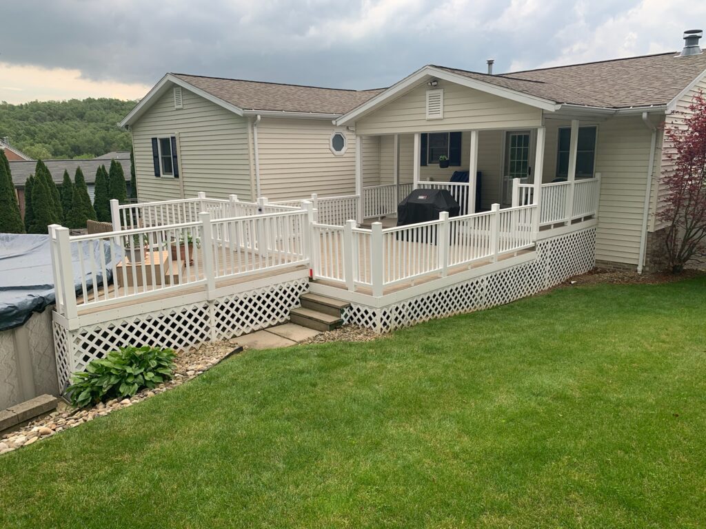 small custom white deck build off of a pool